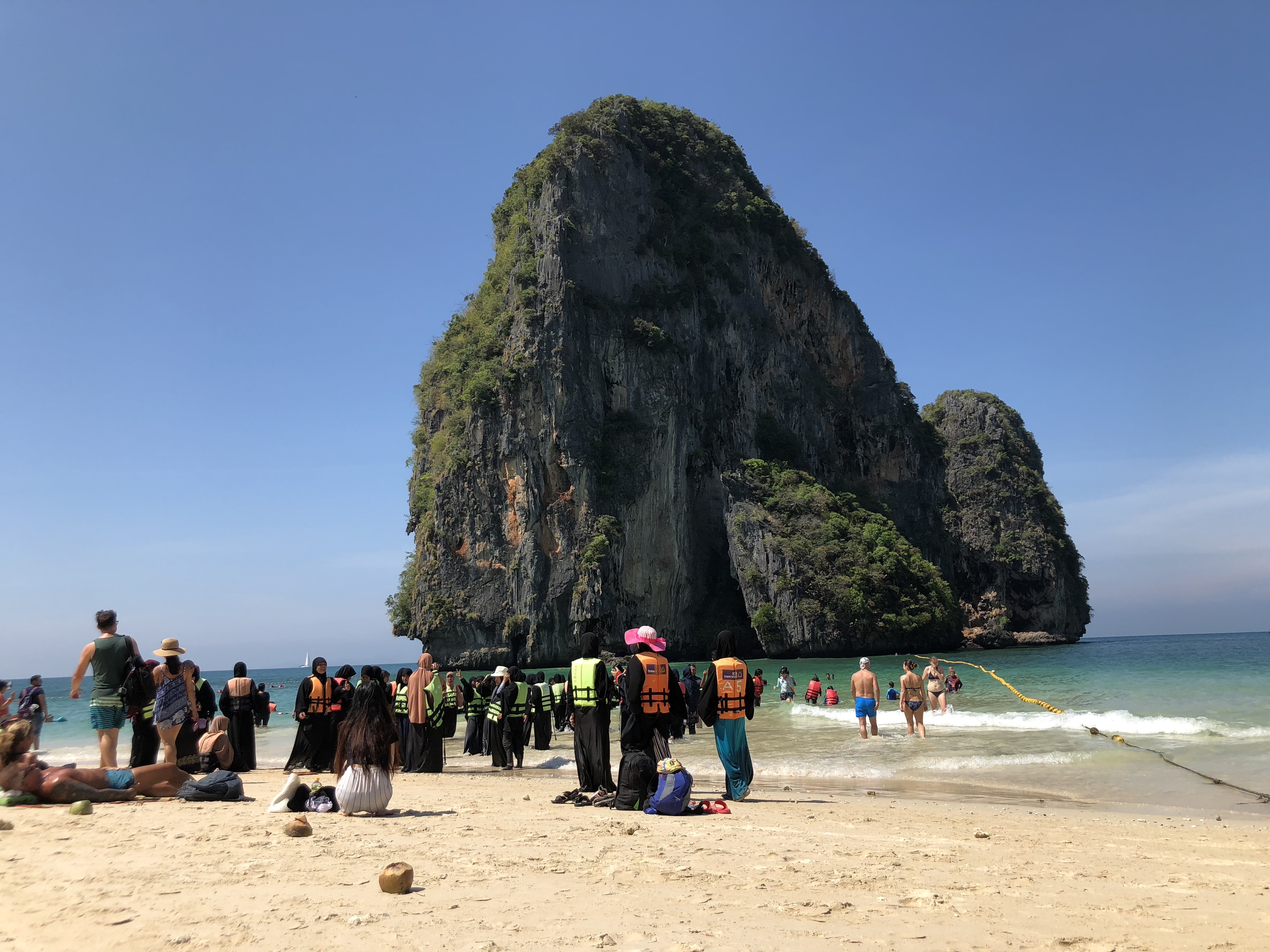 Islamic people enjoying the water in Phra Nang Cave beach